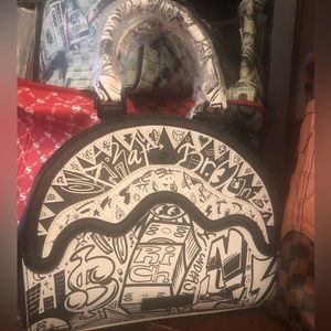 Black and white purse with strap inside